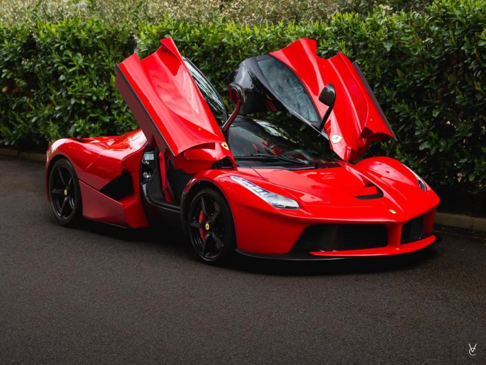 Rosso Ferrari LaFerrari with doors raised
